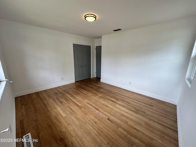 1118 Brookmont Ave E, Jacksonville, FL 32211 - empty room with wood finished floors and baseboards