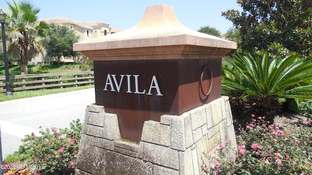 community sign featuring fence