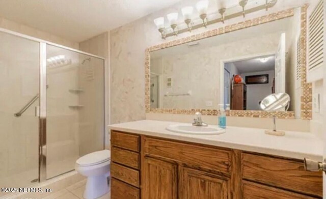500 Sandiron Cir Unit 517, Ponte Vedra Beach, FL 32082 - bathroom with tile patterned flooring, vanity, toilet, and a shower stall