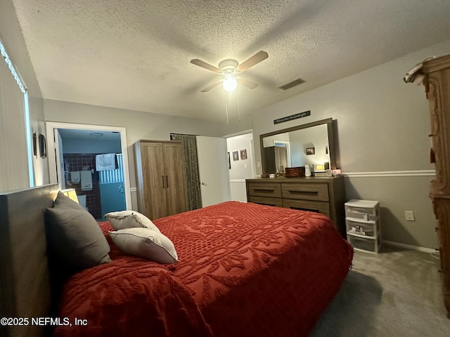 bedroom featuring a textured ceiling, visible vents, ceiling fan, baseboards, and carpet floors