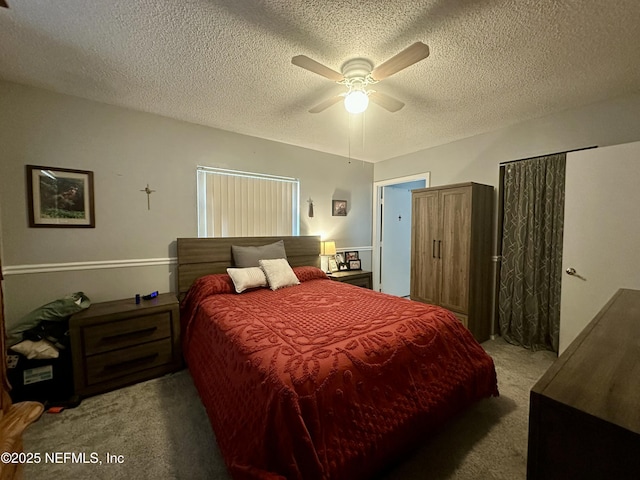 bedroom with a textured ceiling, a ceiling fan, and carpet flooring