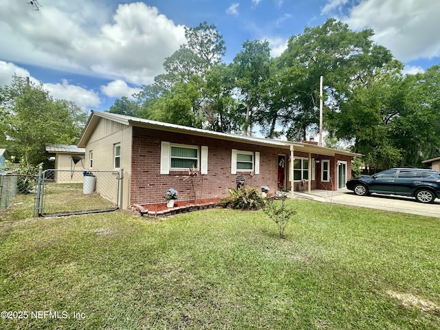single story home featuring a gate, a chimney, a front yard, fence, and brick siding