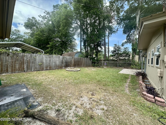 view of yard with a fenced backyard