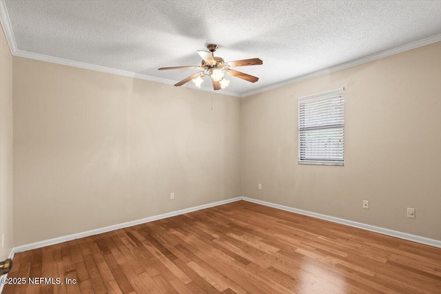 spare room with light wood-style floors, crown molding, a textured ceiling, and ceiling fan