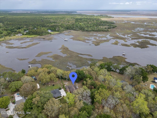 aerial view featuring a water view and a wooded view