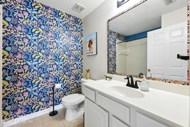 157 Jardin De Mer Pl Unit 157, Jacksonville Beach, FL 32250 - full bathroom featuring a textured ceiling, visible vents, tile patterned floors, vanity, and toilet
