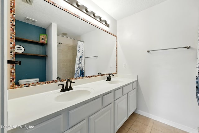 157 Jardin De Mer Pl Unit 157, Jacksonville Beach, FL 32250 - full bath with a textured ceiling, tile patterned floors, visible vents, and a sink