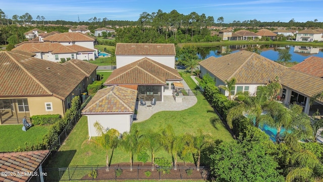 bird's eye view with a residential view and a water view