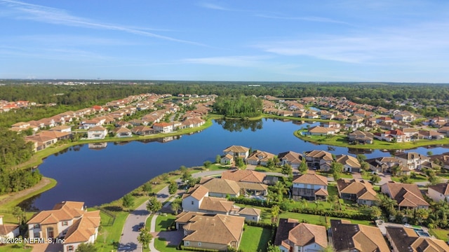 birds eye view of property with a residential view and a water view