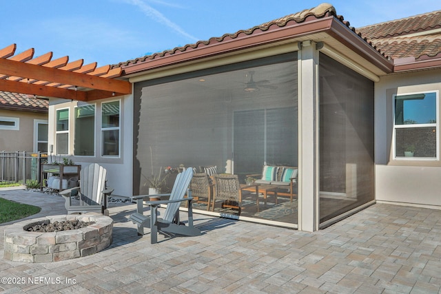 view of patio / terrace featuring a pergola and a fire pit