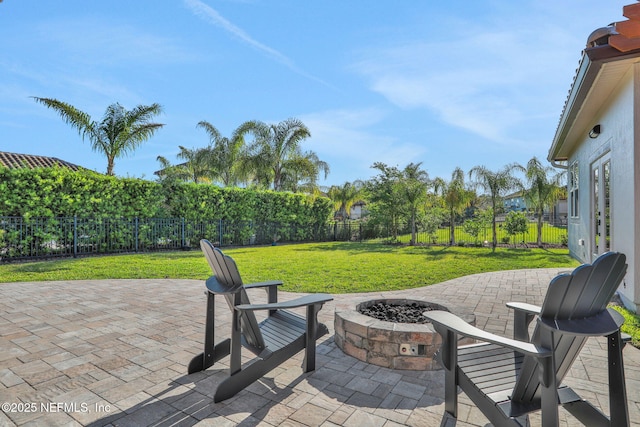 view of patio / terrace featuring a fire pit and a fenced backyard