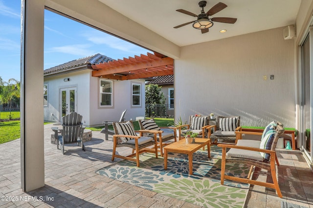 view of patio / terrace featuring ceiling fan, fence, french doors, and a pergola
