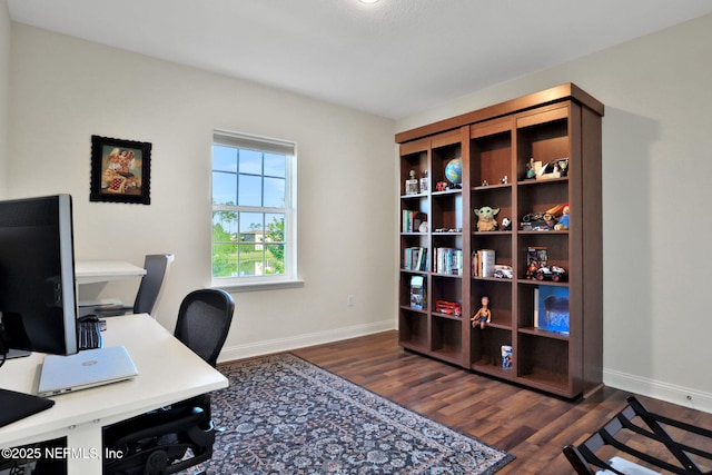 office with wood finished floors and baseboards