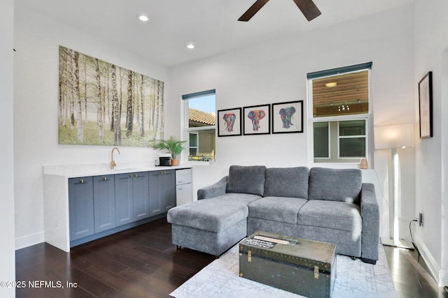 living room with recessed lighting, a ceiling fan, dark wood finished floors, and baseboards