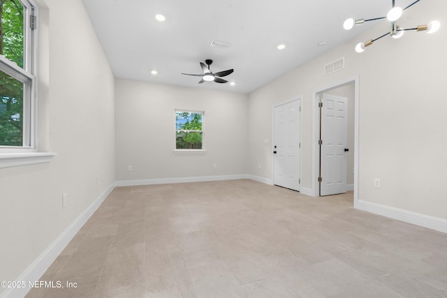 7708 Galveston Ave, Jacksonville, FL 32211 - spare room with baseboards, visible vents, ceiling fan with notable chandelier, and recessed lighting