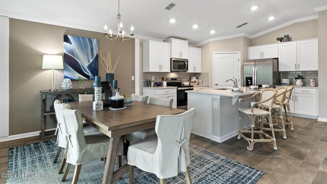 dining room with ornamental molding, a notable chandelier, recessed lighting, and visible vents