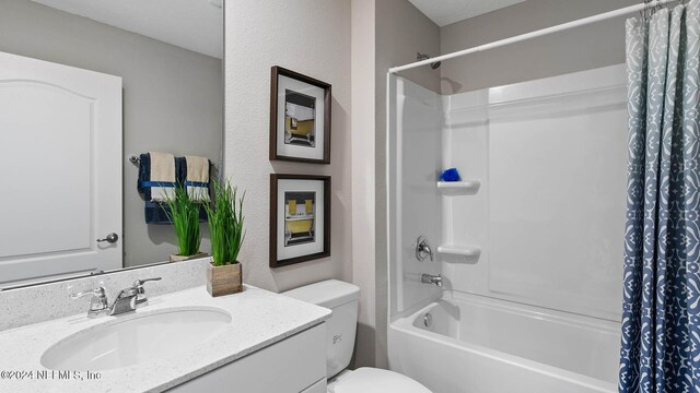 bathroom with shower / tub combo, toilet, and vanity