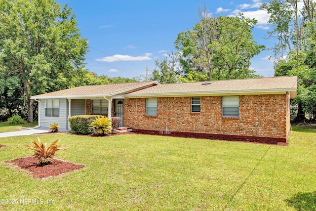 4043 Marland St, Jacksonville, FL 32209 - ranch-style home with a front lawn, roof with shingles, and brick siding