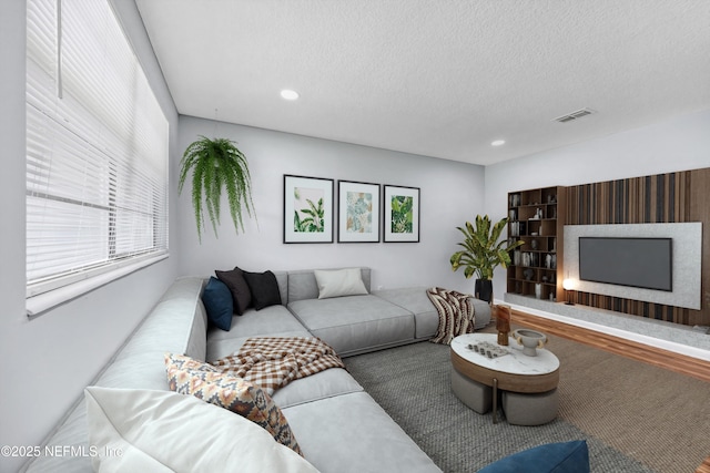 4043 Marland St, Jacksonville, FL 32209 - living area with recessed lighting, a textured ceiling, and visible vents