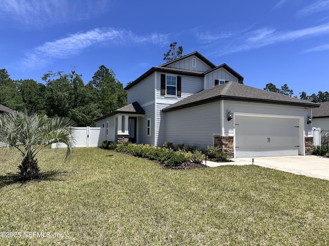 1116 Morgans Treasure Rd, Saint Augustine, FL 32084 - view of front of home featuring fence, a front yard, board and batten siding, an attached garage, and driveway