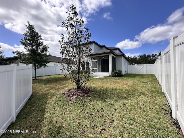 1116 Morgans Treasure Rd, Saint Augustine, FL 32084 - view of yard with a sunroom, a gate, and a fenced backyard