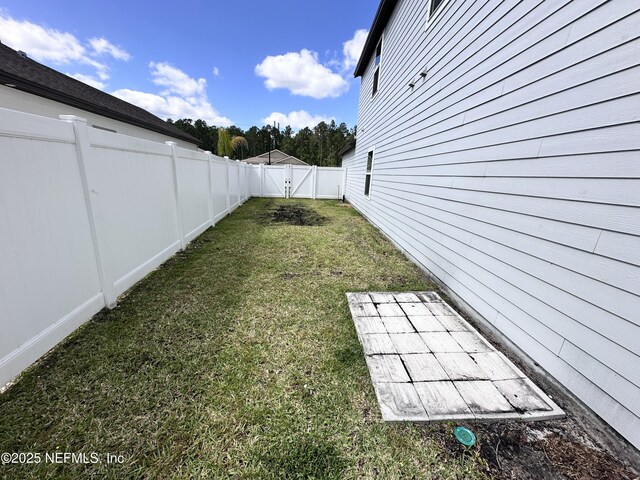 1116 Morgans Treasure Rd, Saint Augustine, FL 32084 - view of yard featuring a fenced backyard and a gate