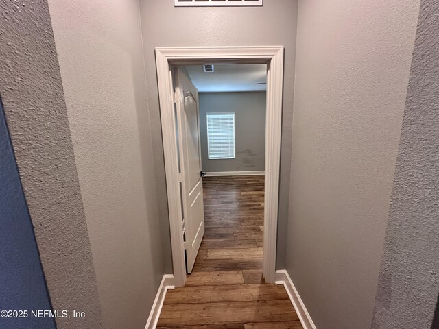 1116 Morgans Treasure Rd, Saint Augustine, FL 32084 - corridor with baseboards, a textured wall, and hardwood / wood-style floors