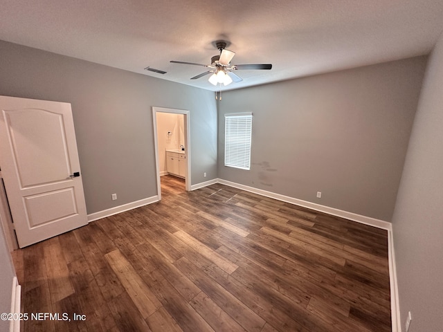 1116 Morgans Treasure Rd, Saint Augustine, FL 32084 - unfurnished bedroom featuring connected bathroom, a ceiling fan, baseboards, visible vents, and dark wood-style floors