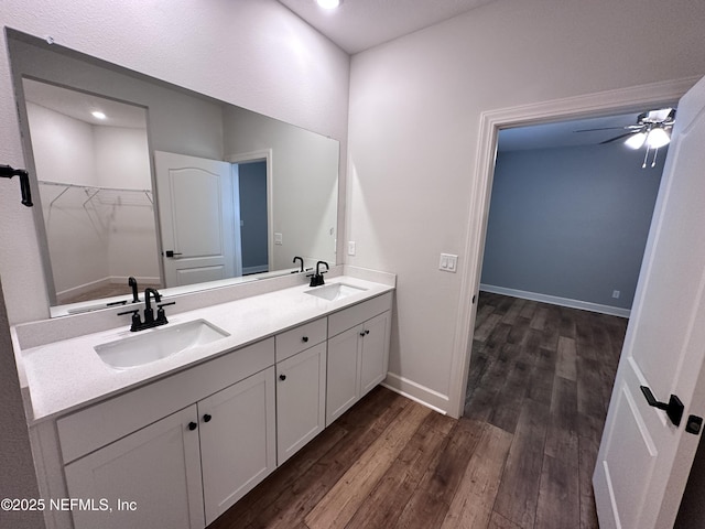 1116 Morgans Treasure Rd, Saint Augustine, FL 32084 - full bathroom with double vanity, a sink, a ceiling fan, and wood finished floors