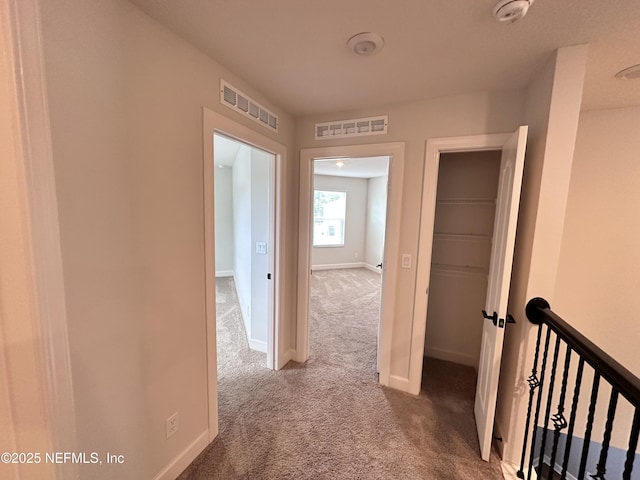 1116 Morgans Treasure Rd, Saint Augustine, FL 32084 - corridor with baseboards, an upstairs landing, carpet flooring, and visible vents