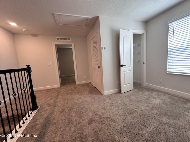 1116 Morgans Treasure Rd, Saint Augustine, FL 32084 - unfurnished bedroom featuring baseboards, visible vents, carpet, and a closet