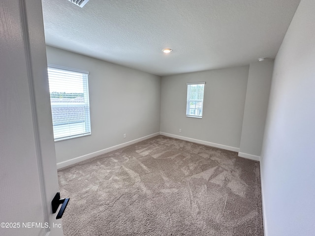 1116 Morgans Treasure Rd, Saint Augustine, FL 32084 - spare room featuring carpet floors, baseboards, and a textured ceiling