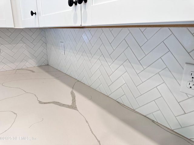 1116 Morgans Treasure Rd, Saint Augustine, FL 32084 - interior details featuring white cabinets and light stone counters