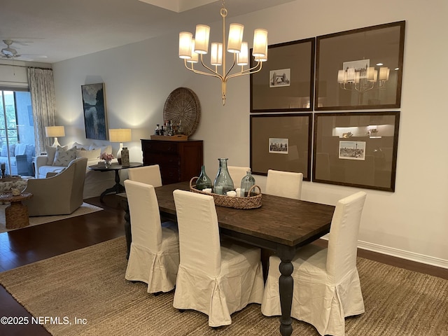 1207 Makarios Dr, Saint Augustine Beach, FL 32080 - dining space featuring a chandelier, wood finished floors, and a ceiling fan