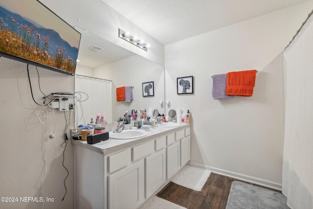 3416 Concord Ct, Green Cove Springs, FL 32043 - full bath with double vanity, wood finished floors, baseboards, and a sink