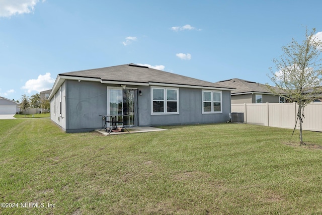 3416 Concord Ct, Green Cove Springs, FL 32043 - rear view of house with fence, central AC unit, and a yard
