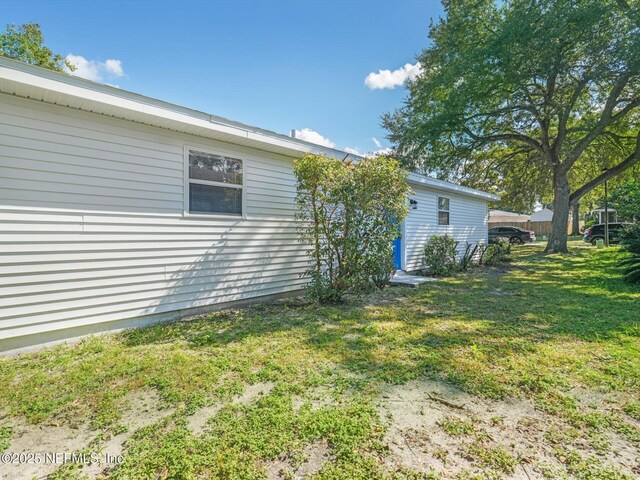 1615 Brook Forest Dr, Jacksonville, FL 32208 - view of side of home with a lawn