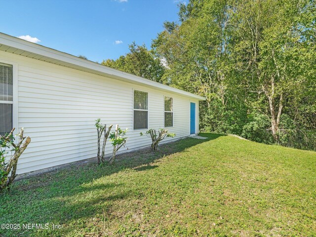 1615 Brook Forest Dr, Jacksonville, FL 32208 - view of home's exterior with a lawn