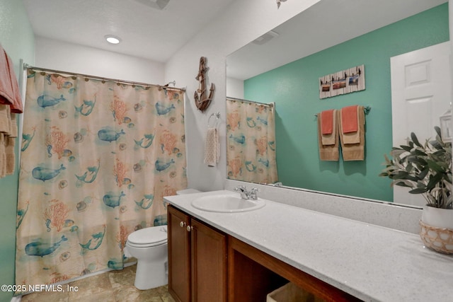 bathroom with vanity, toilet, and a shower with curtain
