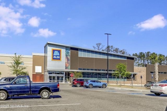 view of property with uncovered parking