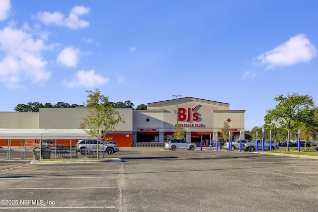 view of property with uncovered parking