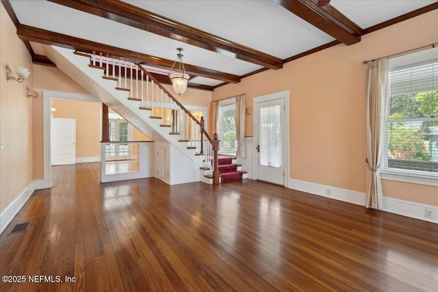 223 Rainey Ave, Saint Augustine, FL 32084 - unfurnished living room with beamed ceiling, hardwood / wood-style flooring, a wealth of natural light, and stairway