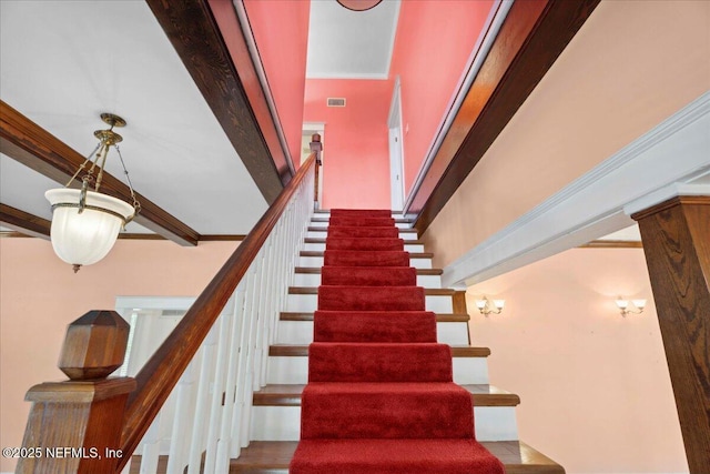 223 Rainey Ave, Saint Augustine, FL 32084 - staircase featuring crown molding
