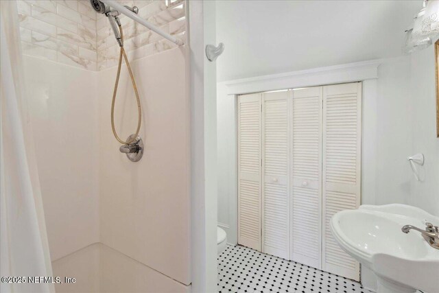 223 Rainey Ave, Saint Augustine, FL 32084 - full bathroom featuring a sink, toilet, and a shower stall