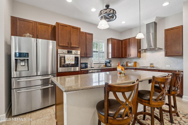 74 Lone Eagle Way, Ponte Vedra, FL 32081 - kitchen featuring decorative backsplash, a sink, light stone counters, stainless steel appliances, and wall chimney exhaust hood