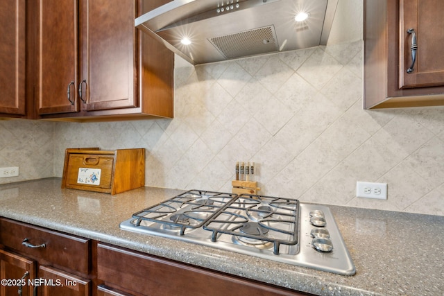74 Lone Eagle Way, Ponte Vedra, FL 32081 - kitchen with stainless steel gas cooktop, decorative backsplash, and range hood