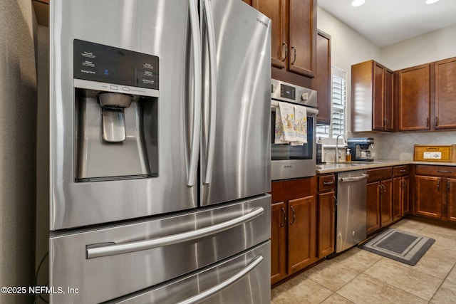 74 Lone Eagle Way, Ponte Vedra, FL 32081 - kitchen featuring tasteful backsplash, a sink, light countertops, stainless steel appliances, and light tile patterned flooring