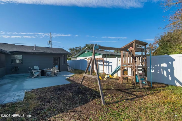 view of play area featuring a fenced backyard and a patio area