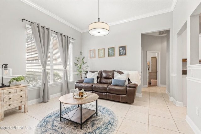 living area featuring crown molding, light tile patterned floors, and baseboards