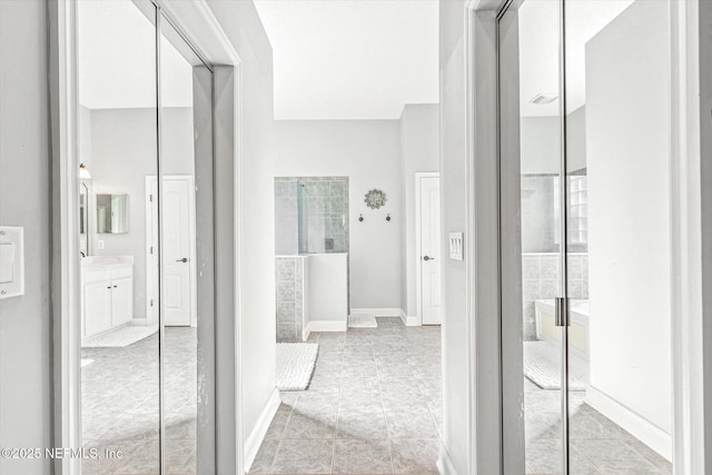 hallway featuring baseboards